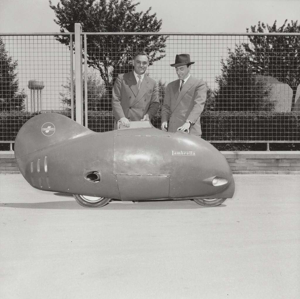 1951 Engineers Pierluigi Torre and Luigi Innocenti pose with the fish shaped vehicle named Sirulo