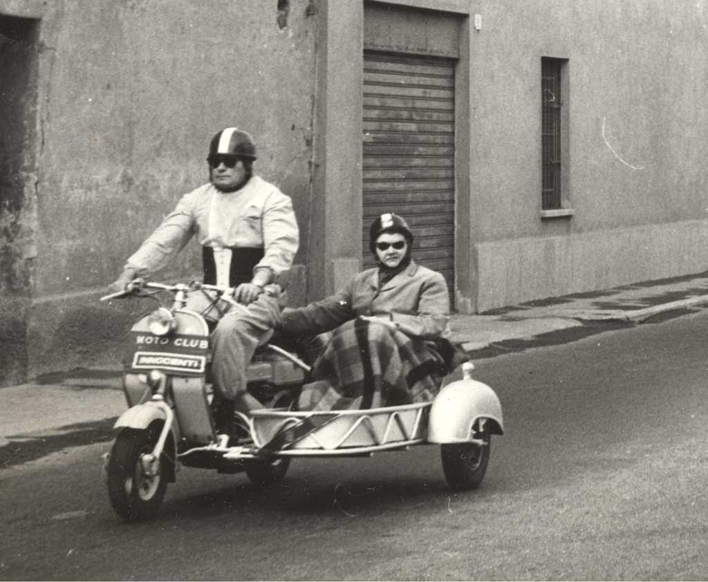 1954 Lambretta 125D with sidecar and two man driving