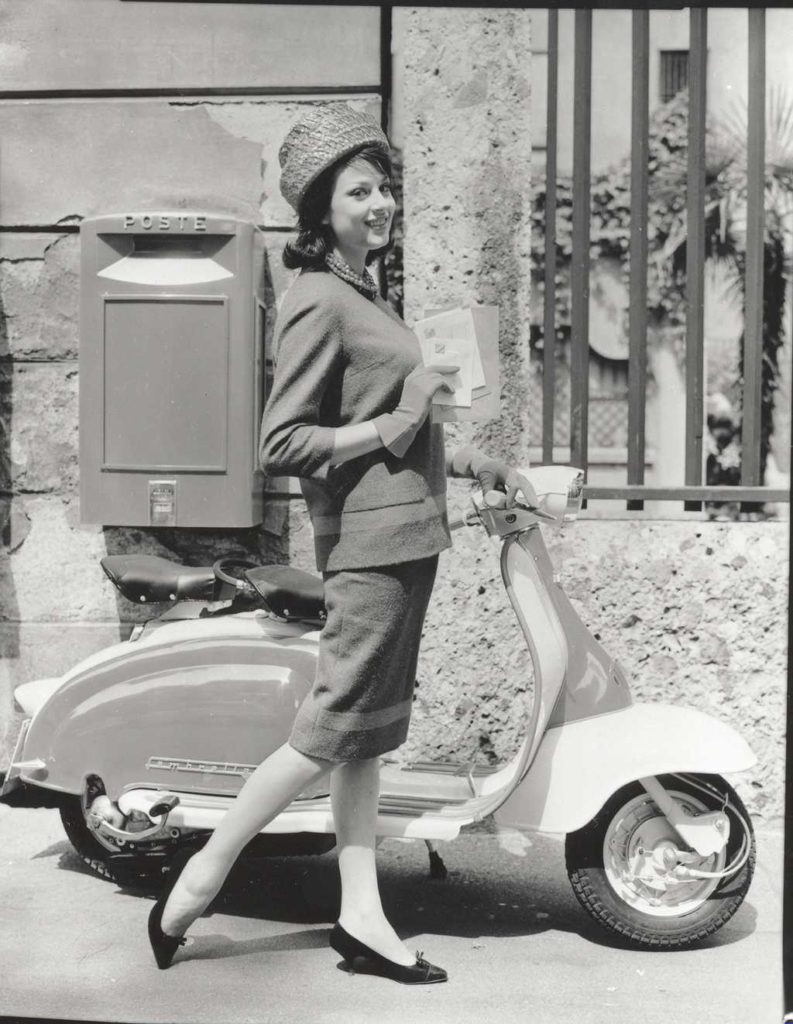1960 Lambretta scooter and lady in front of mailbox