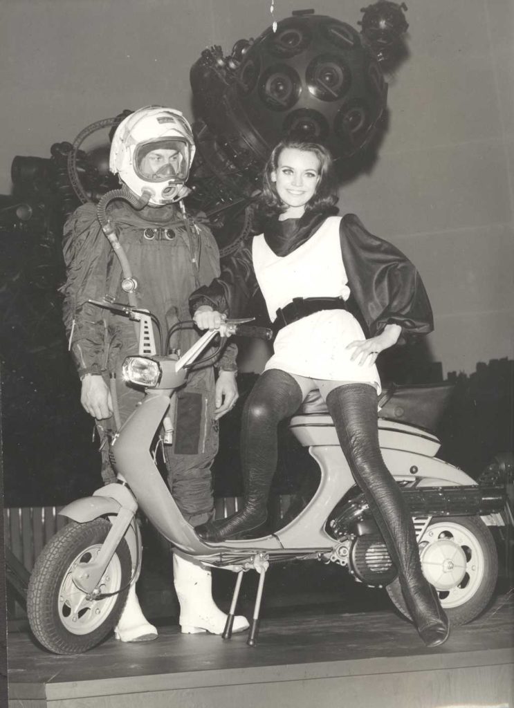 1968 man and woman next to Lambretta scooter
