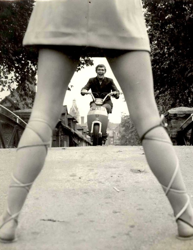 1968 Lambretta scooter through womans legs